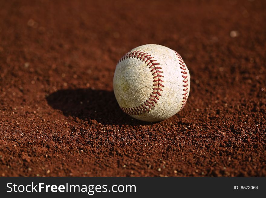 Baseball on the green grass of a ball field