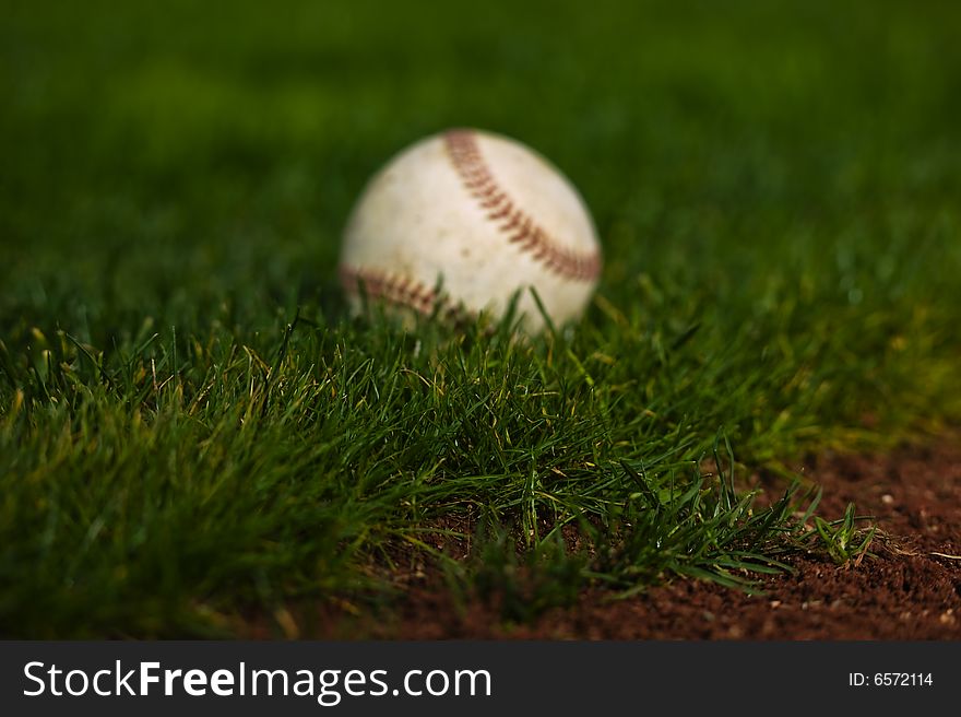 Baseball on the green grass of a ball field