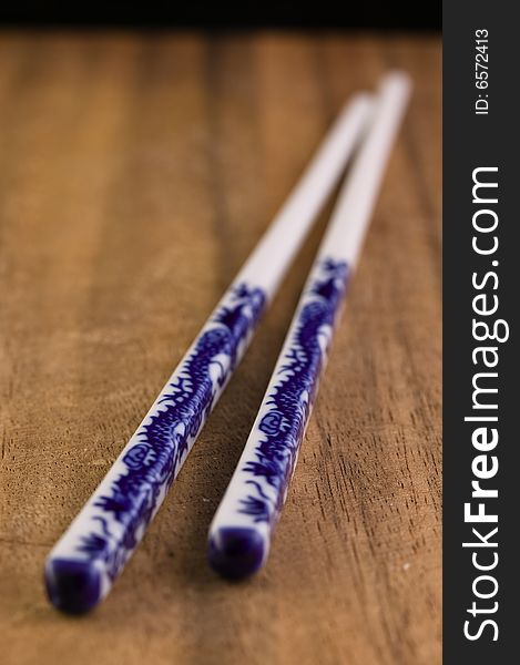 Chopsticks on a wood cutting board
