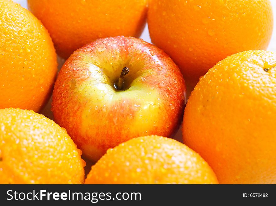 Apples and oranges isolated on a white background. Apples and oranges isolated on a white background