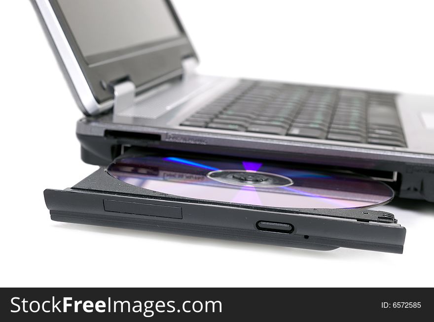 Laptop with opened DVD tray on white background
