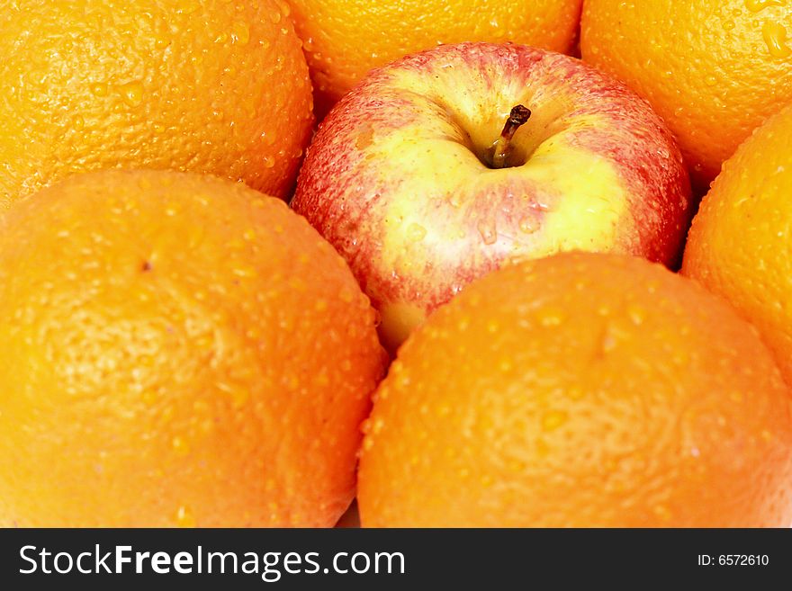 Apples and oranges isolated on a white background. Apples and oranges isolated on a white background