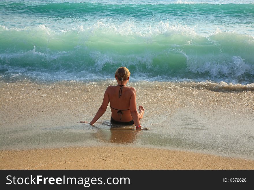 Girl, sea, waves and sandy beach. Girl, sea, waves and sandy beach.