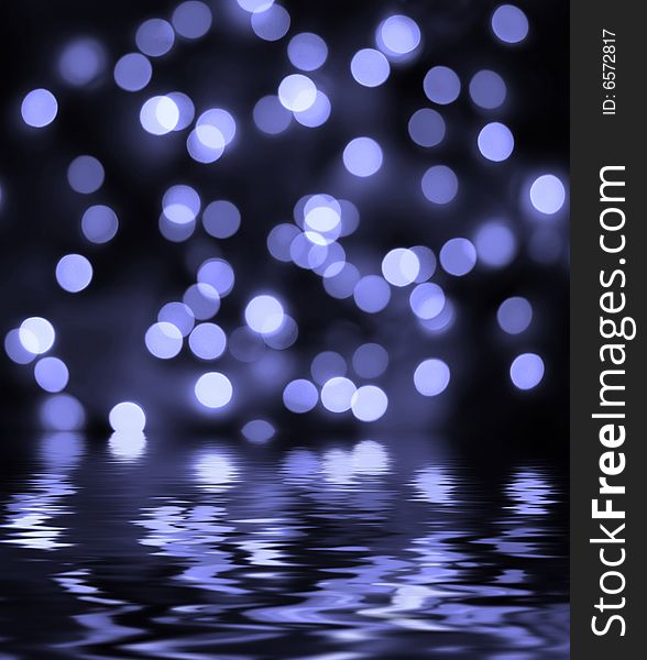 Abstract bokeh background reflected in the water