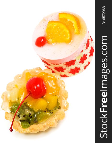 Sweet cakes with fruit on a white background