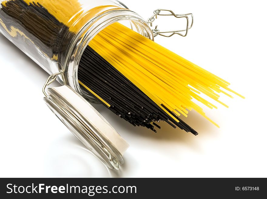 Pasta in glass can on a white background