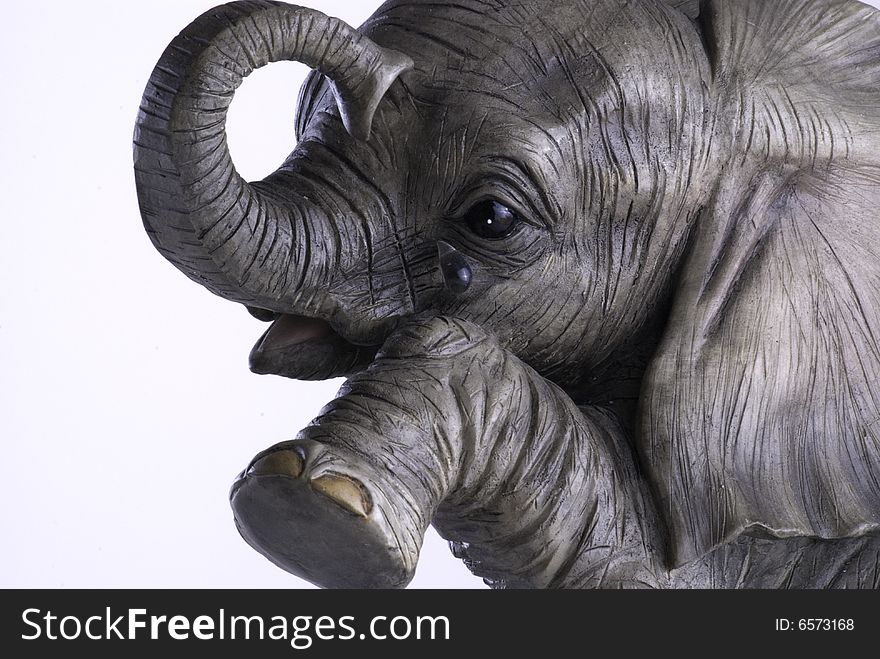 Ornament of a young elephant crying