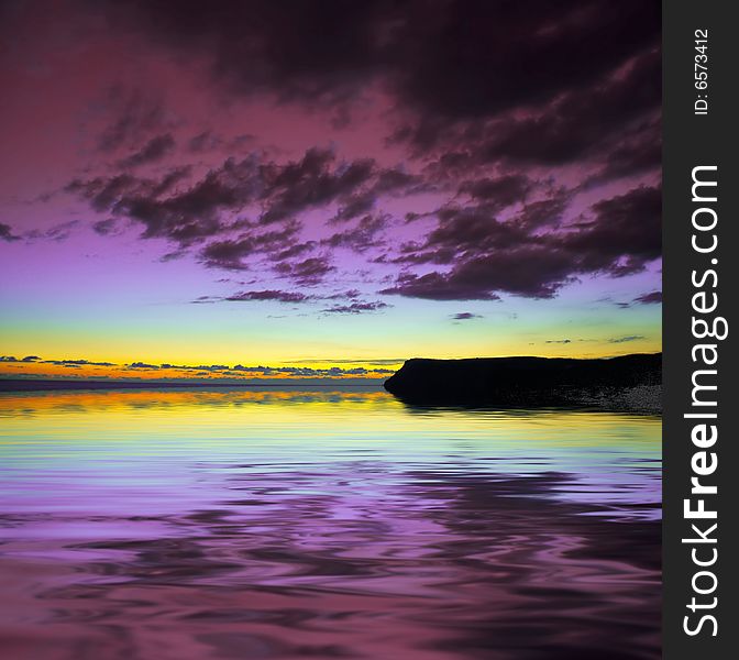 Dramatic violet sky over water