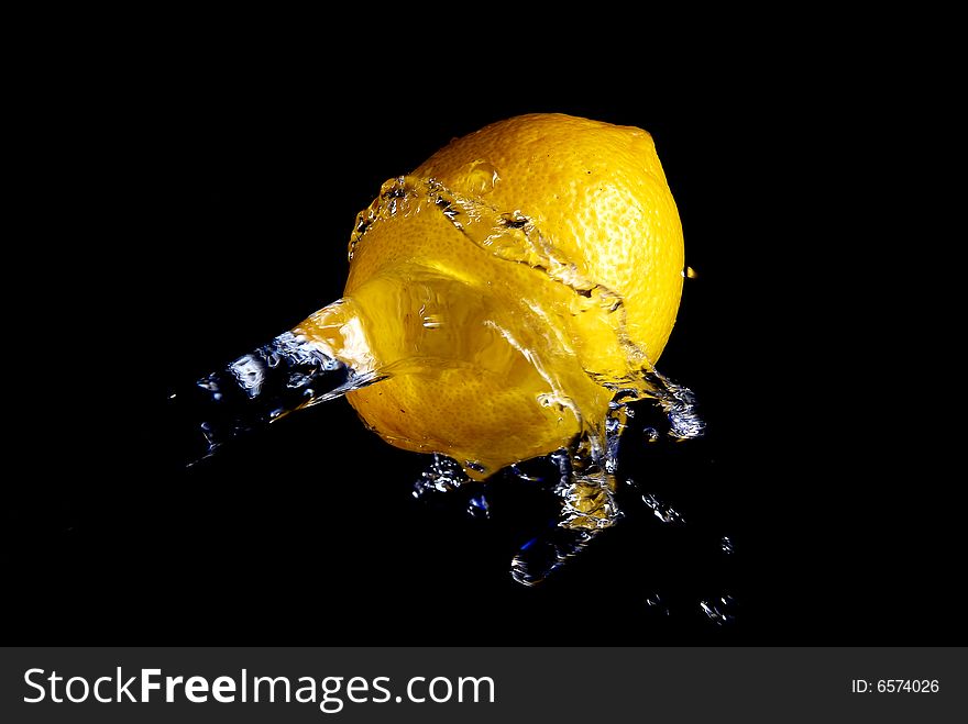 The water which is catching up a lemon in flight
