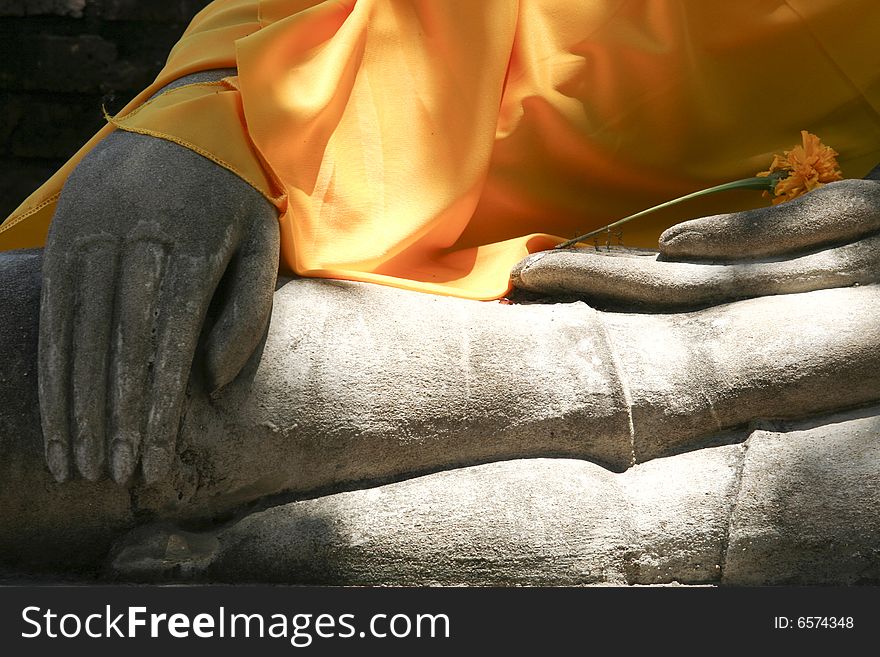 Flower resting in Buddhas Hands