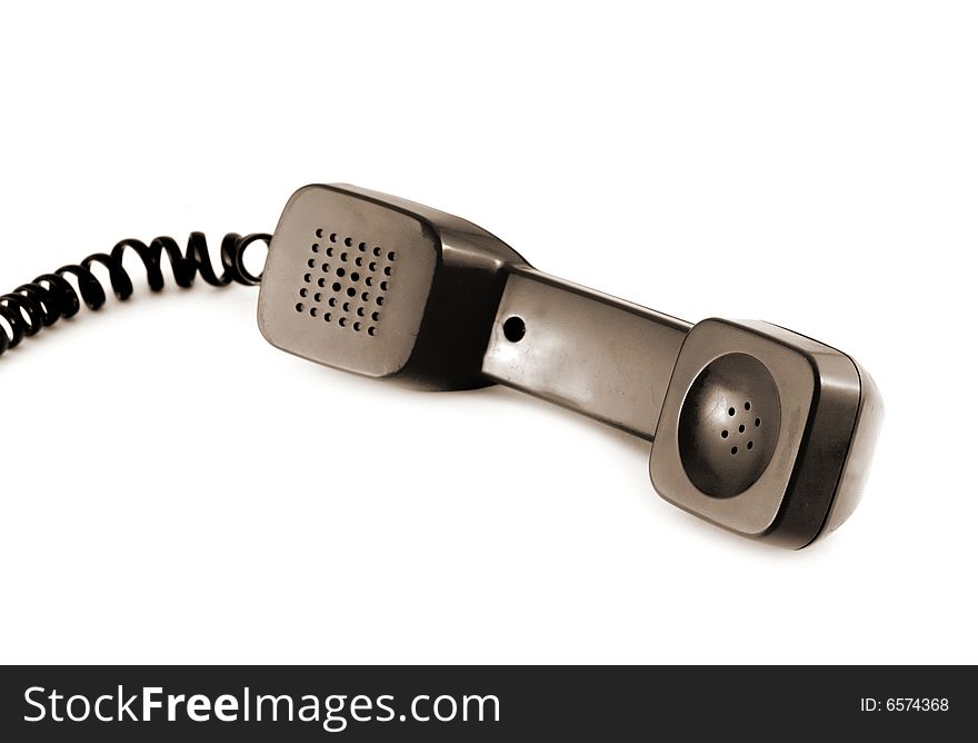 Old style telephone receiver isolated on a white background