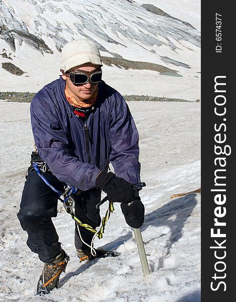 Mountain climber with ice-axe mountaineering on Caucasus