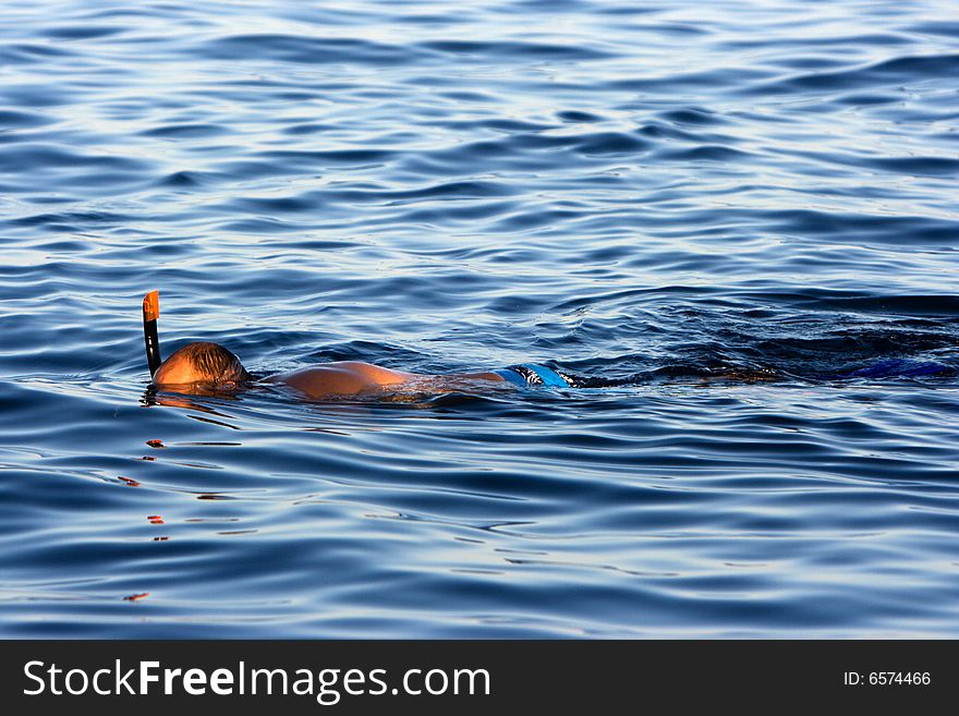 Swimming man in the sea.