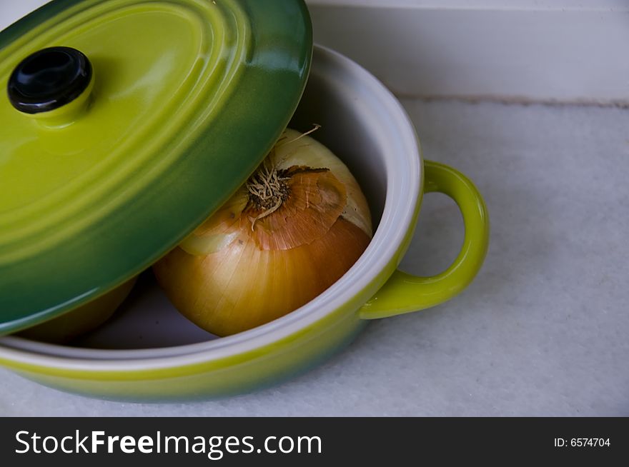 Onion in the green pan. Onion in the green pan