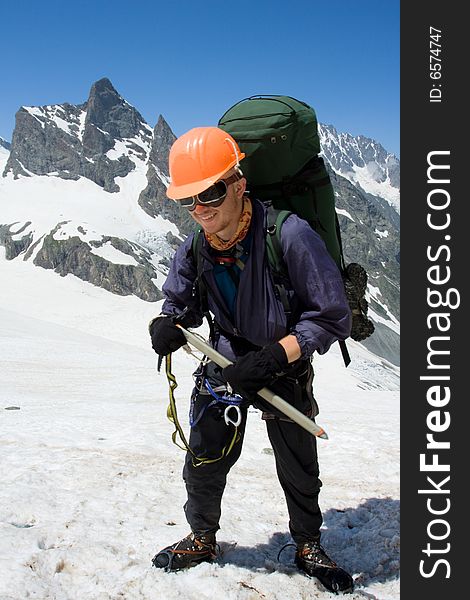 Happy climber in orange helmet