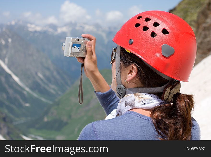 Girl Making A Photo In Mountains