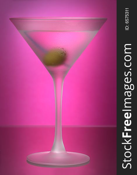 Raspberry or Watermelon Martini in frosted glass, against pink gel background. Raspberry or Watermelon Martini in frosted glass, against pink gel background.