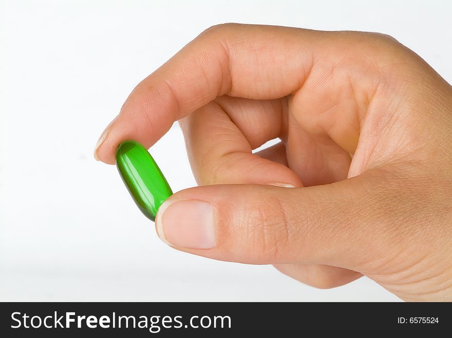 Holding A Green Gel Vitamin