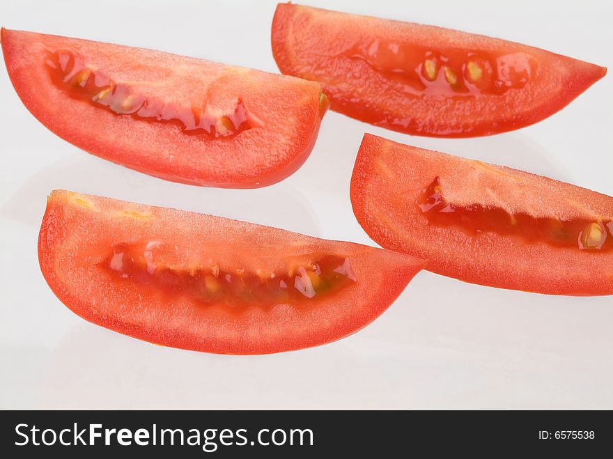 Red and juicy tomato slices. Red and juicy tomato slices