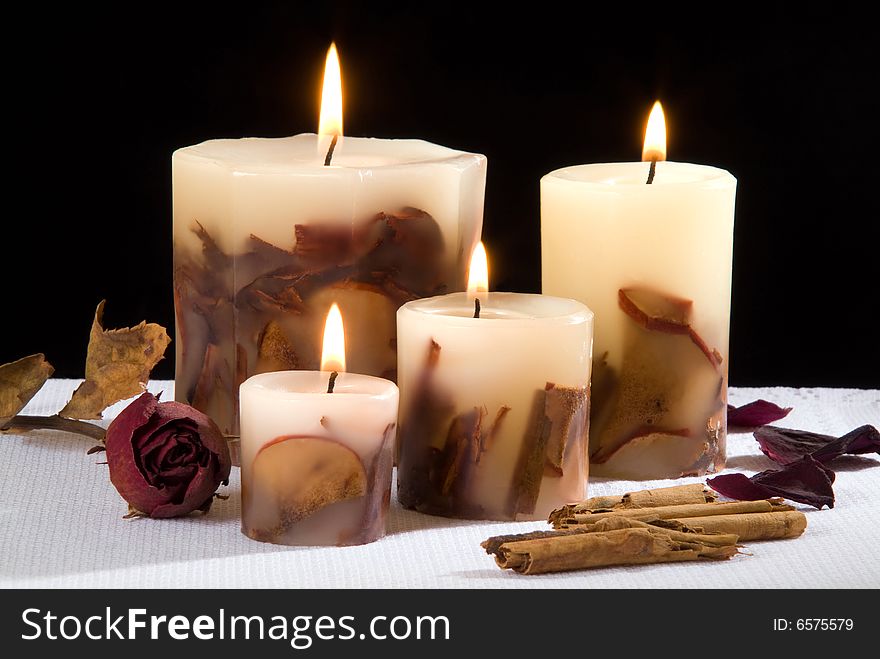 An aromatic candlelight in black background. An aromatic candlelight in black background