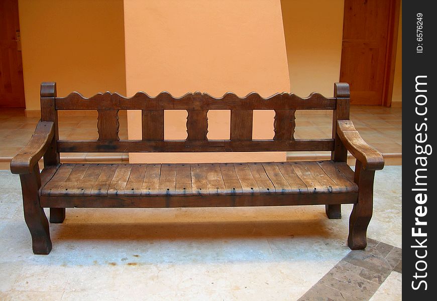 Traditional wood bench with sculptural details