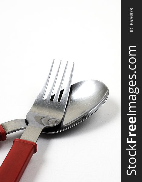 Spoon and fork on a white background