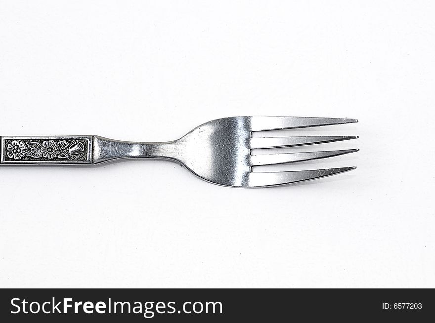 A Silver fork on a White Clean background