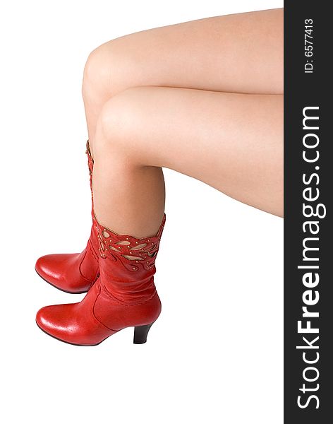 Female legs in red top-boots