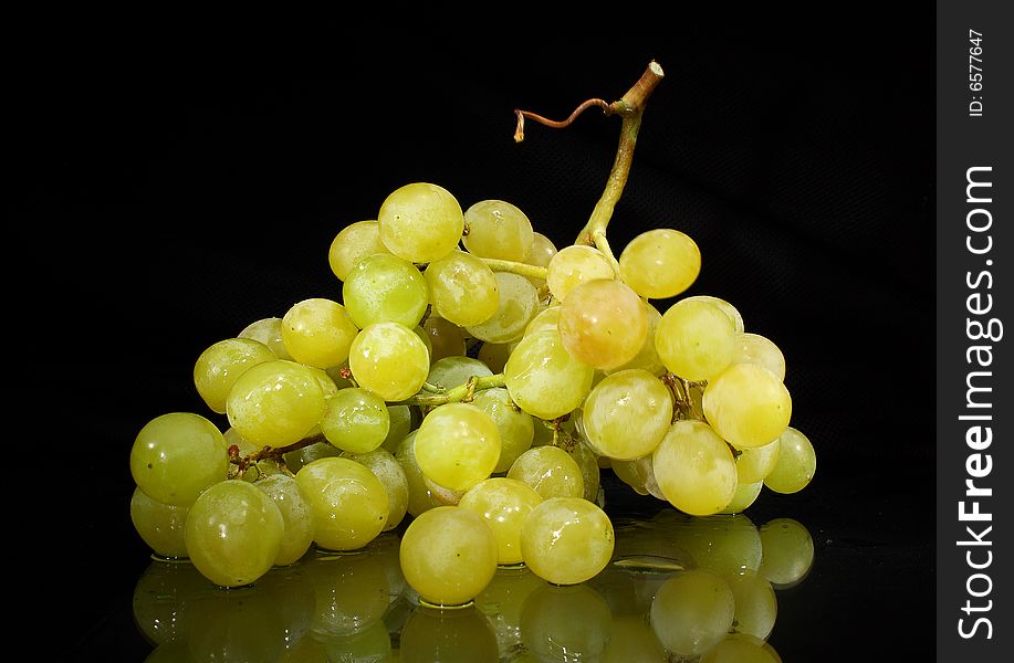 Green grapes on a dark background