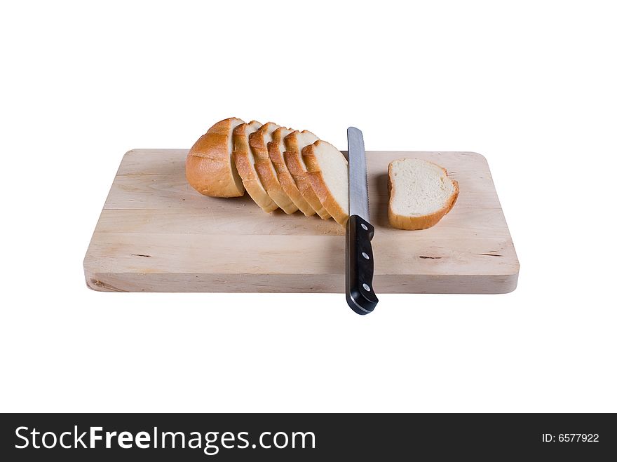 The cut bread on a chopping board. It is isolated, on a white background. The cut bread on a chopping board. It is isolated, on a white background