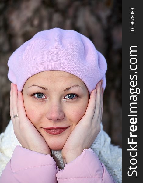 Beautiful smiling girl in pink beret