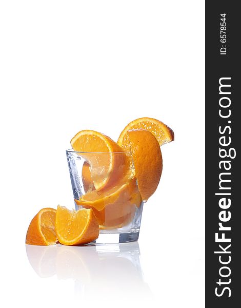 Orange slices in glass isolated in white background