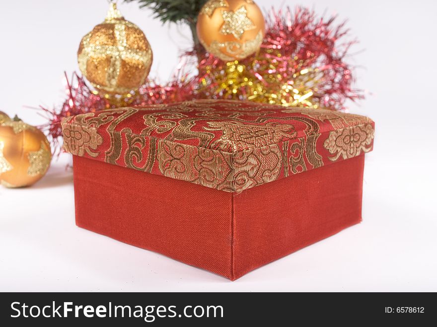 Present box under the Christmas tree isolated on a bright background. Present box under the Christmas tree isolated on a bright background