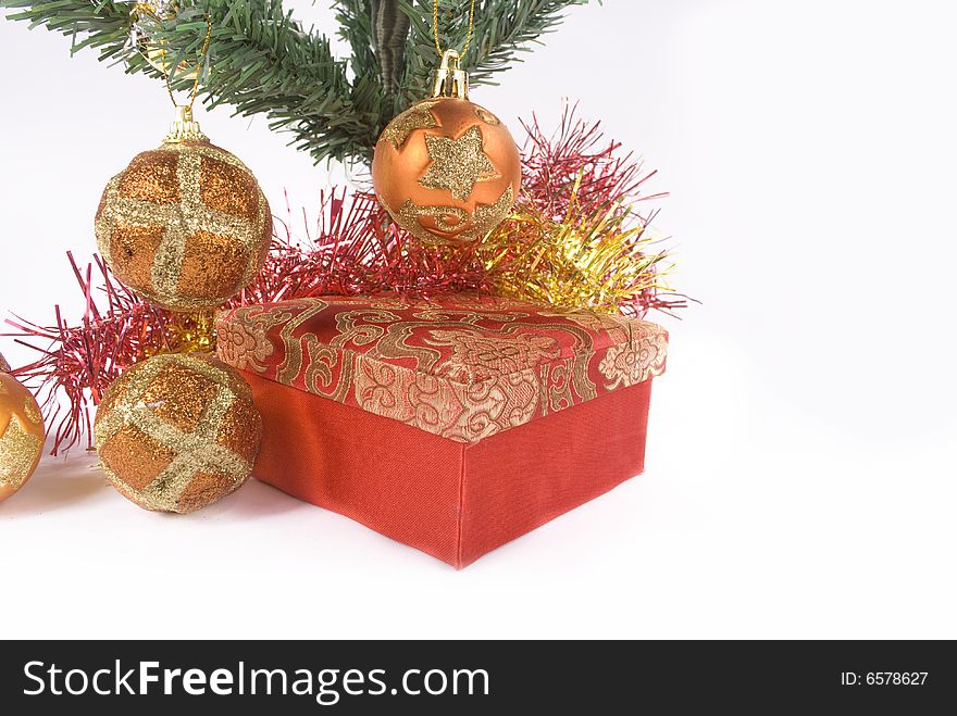 Present box under the Christmas tree isolated on a bright background. Present box under the Christmas tree isolated on a bright background