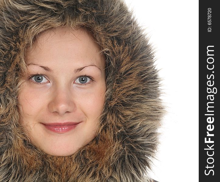 Beautiful girl with blue eyes in fur hood. Beautiful girl with blue eyes in fur hood