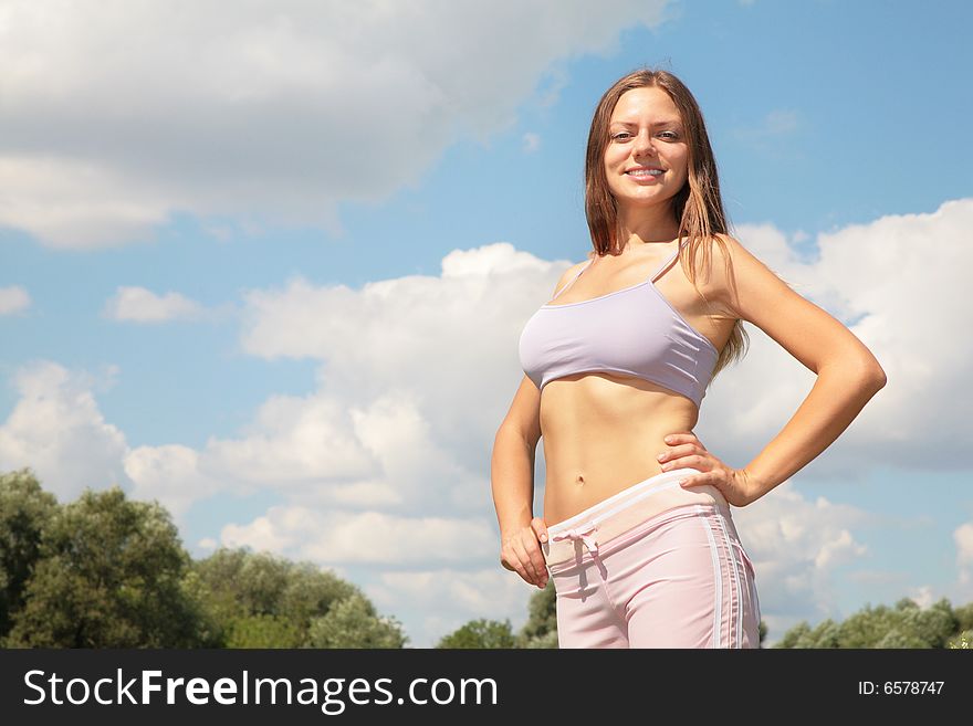 Beauty young woman on sky background