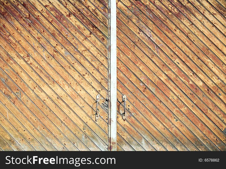 Old wooden weathered warehouse doors. Old wooden weathered warehouse doors