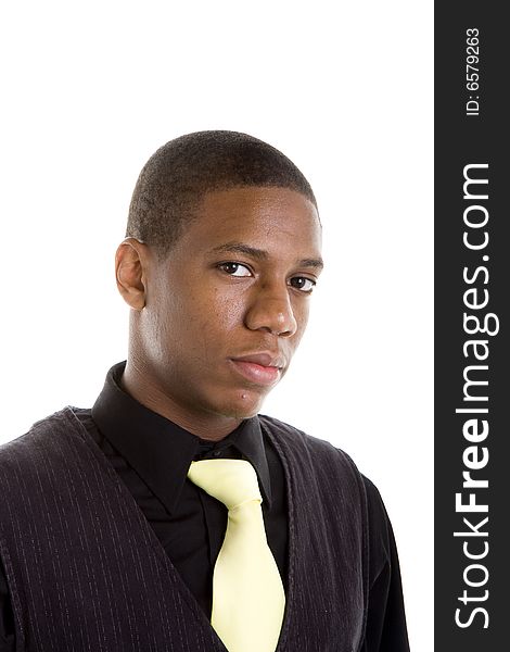 A young black man in a yellow tie, looking at camera with nice eyes. A young black man in a yellow tie, looking at camera with nice eyes