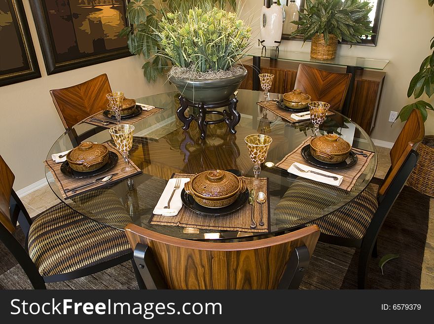 Dining table with modern tableware and decor. Dining table with modern tableware and decor.