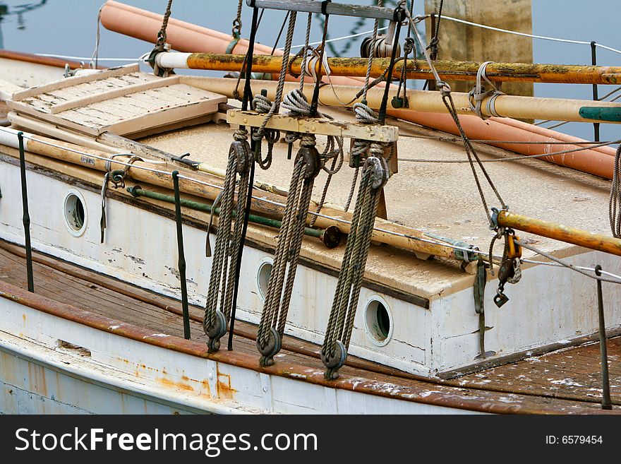 An old wooden sailboat under repair. An old wooden sailboat under repair