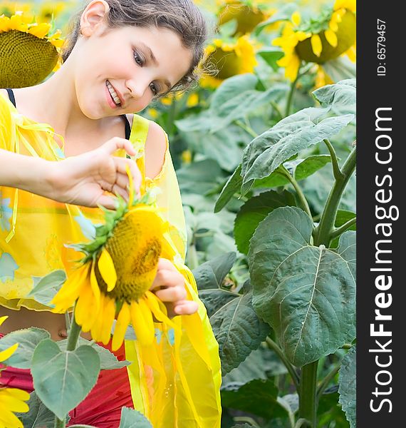 Beauty teen girl and sunflower on nature