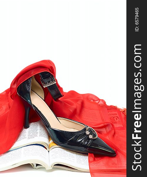 Black shoe and red fabric