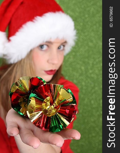 Christmas teen holding decorations.  FOCUS on decorations.