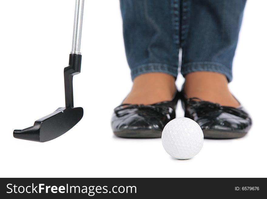 Woman Feet, stick and ball for golf on white