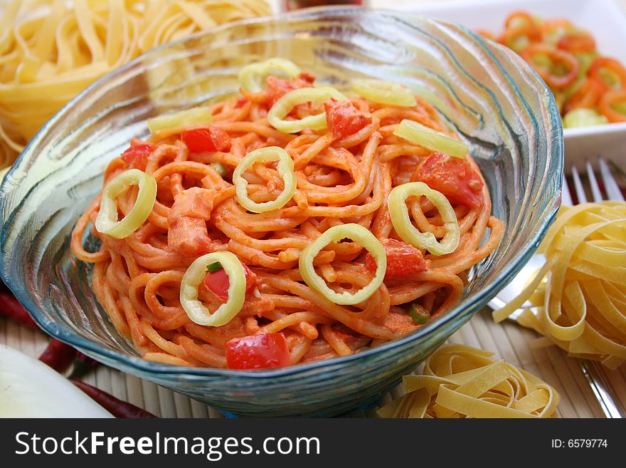 Fresh italian pasta with tomato-sauce and paprika. Fresh italian pasta with tomato-sauce and paprika