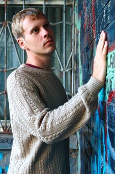 Young Stylish Man Stand Near Graffiti Brick Wall. Royalty Free Stock Photos Young Stylish Man Stand Near Graffiti Brick Wall. Royalty Free Stock Photos