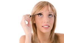 Girl Applying Mascara. Make Up Stock Photos Girl Applying Mascara. Make Up Stock Photos
