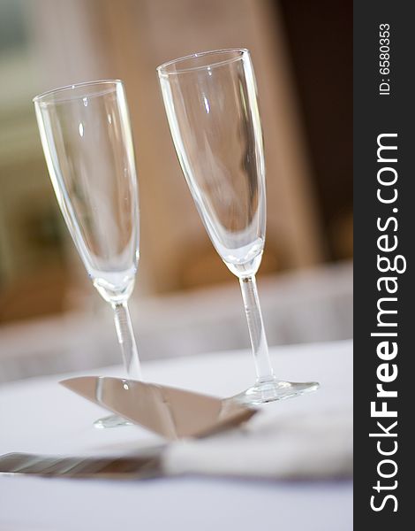 Champagne glasses sitting on a table at wedding
