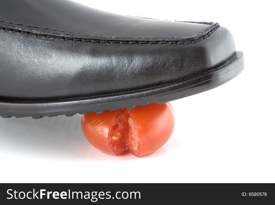 Tomato cracked under shoe pressure. Tomato cracked under shoe pressure