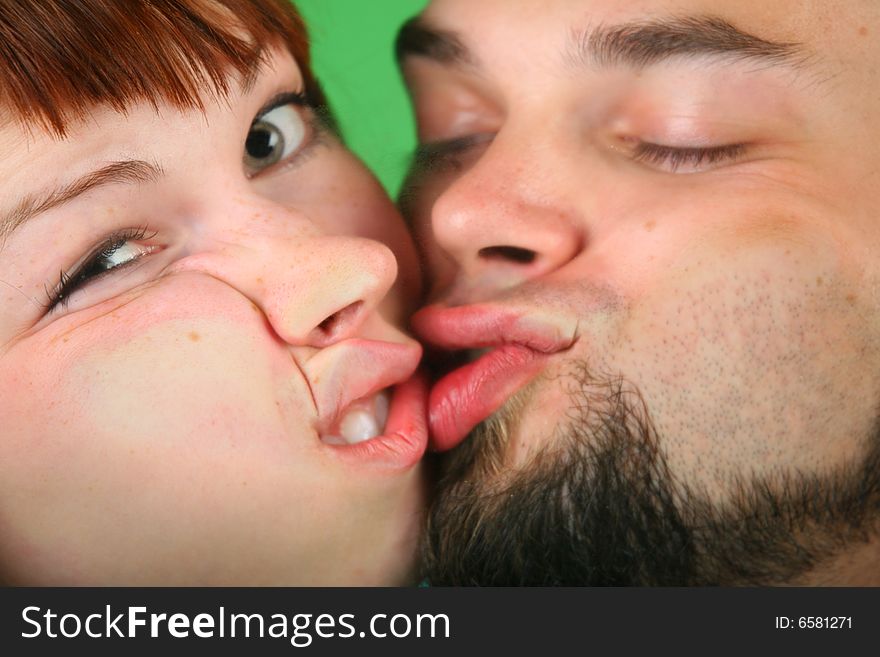 Close Up Girl With Red Hair And Guy Grimace